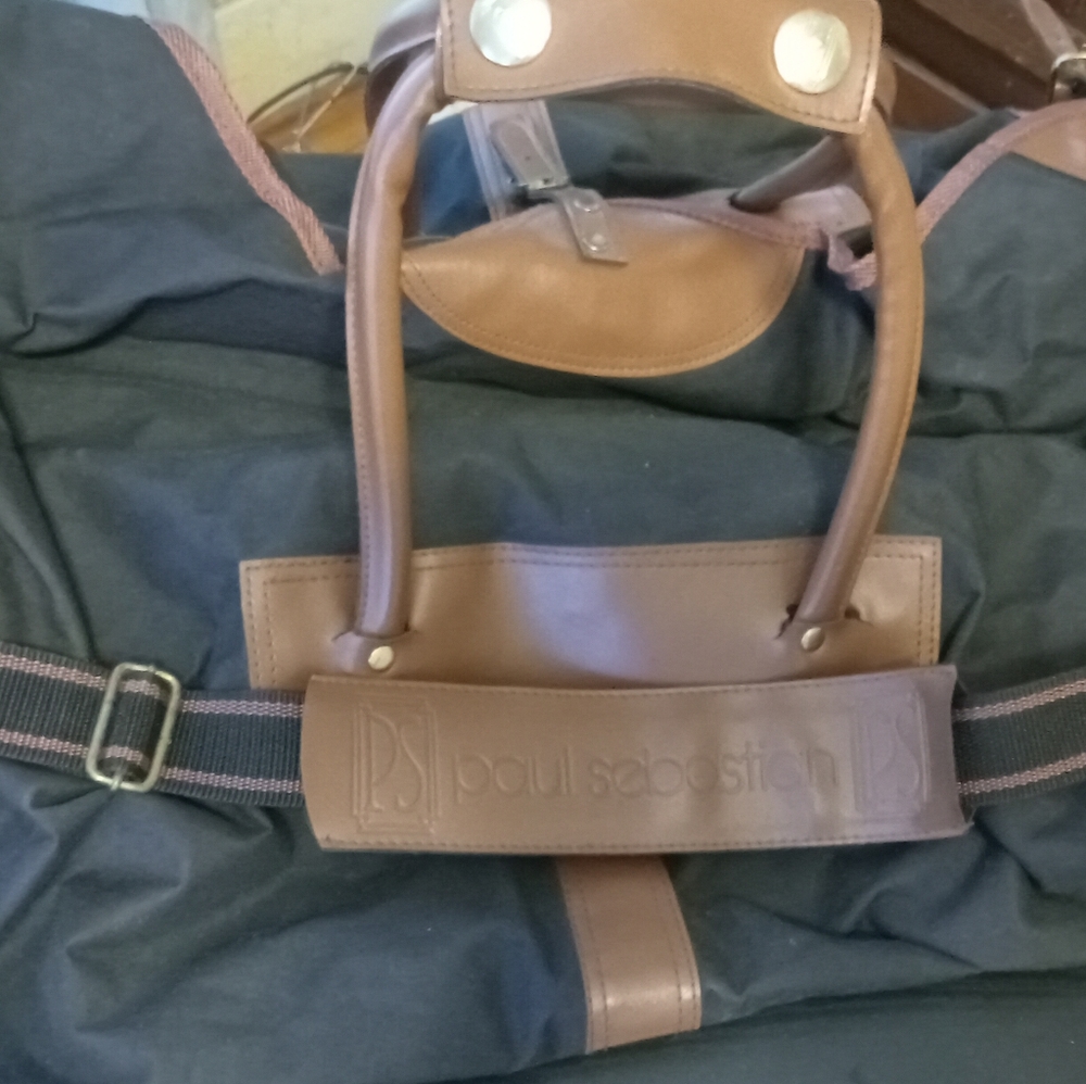 A large tote with straps an buckles